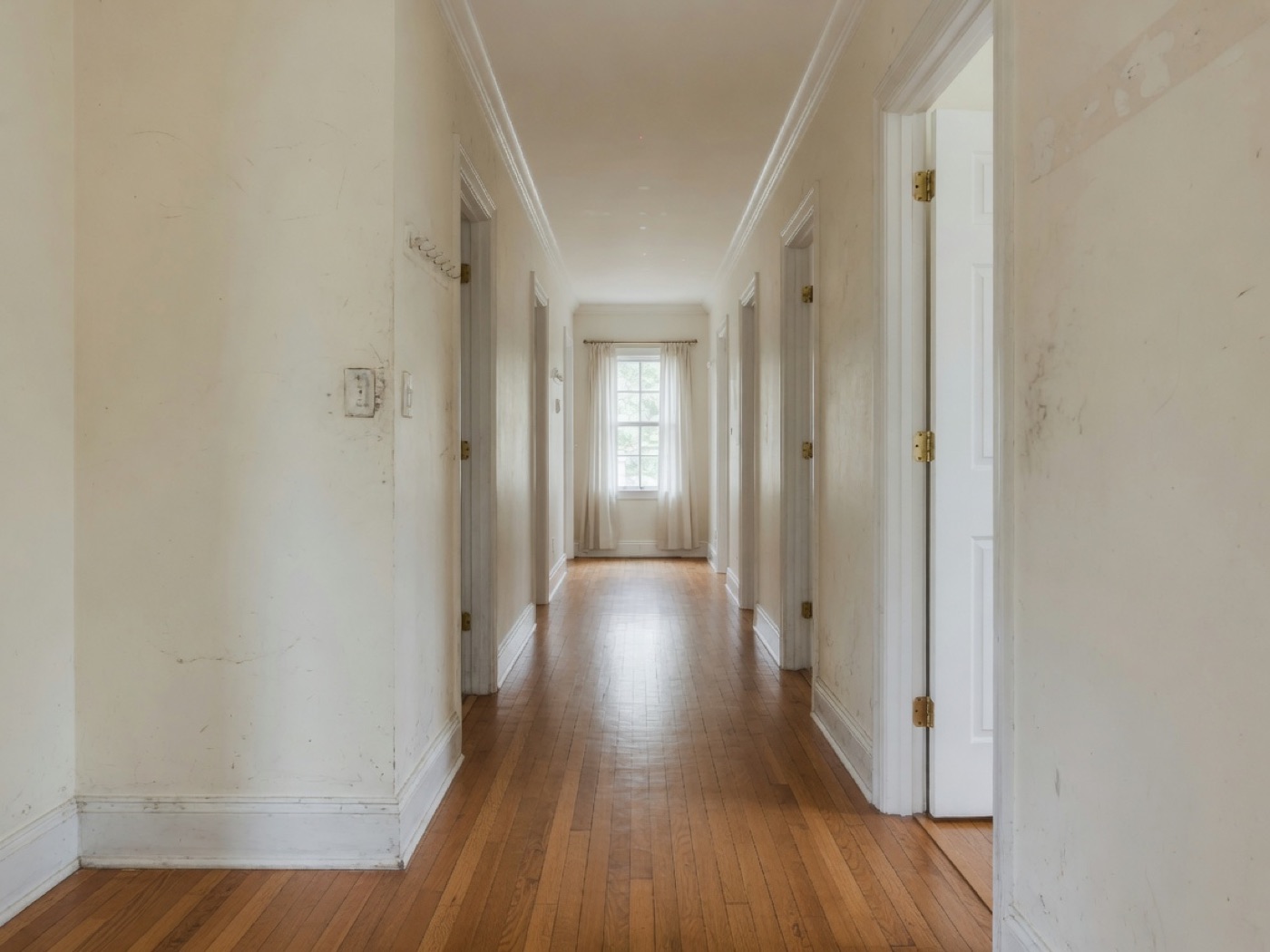 Illustrative hallway before a professional interior repaint