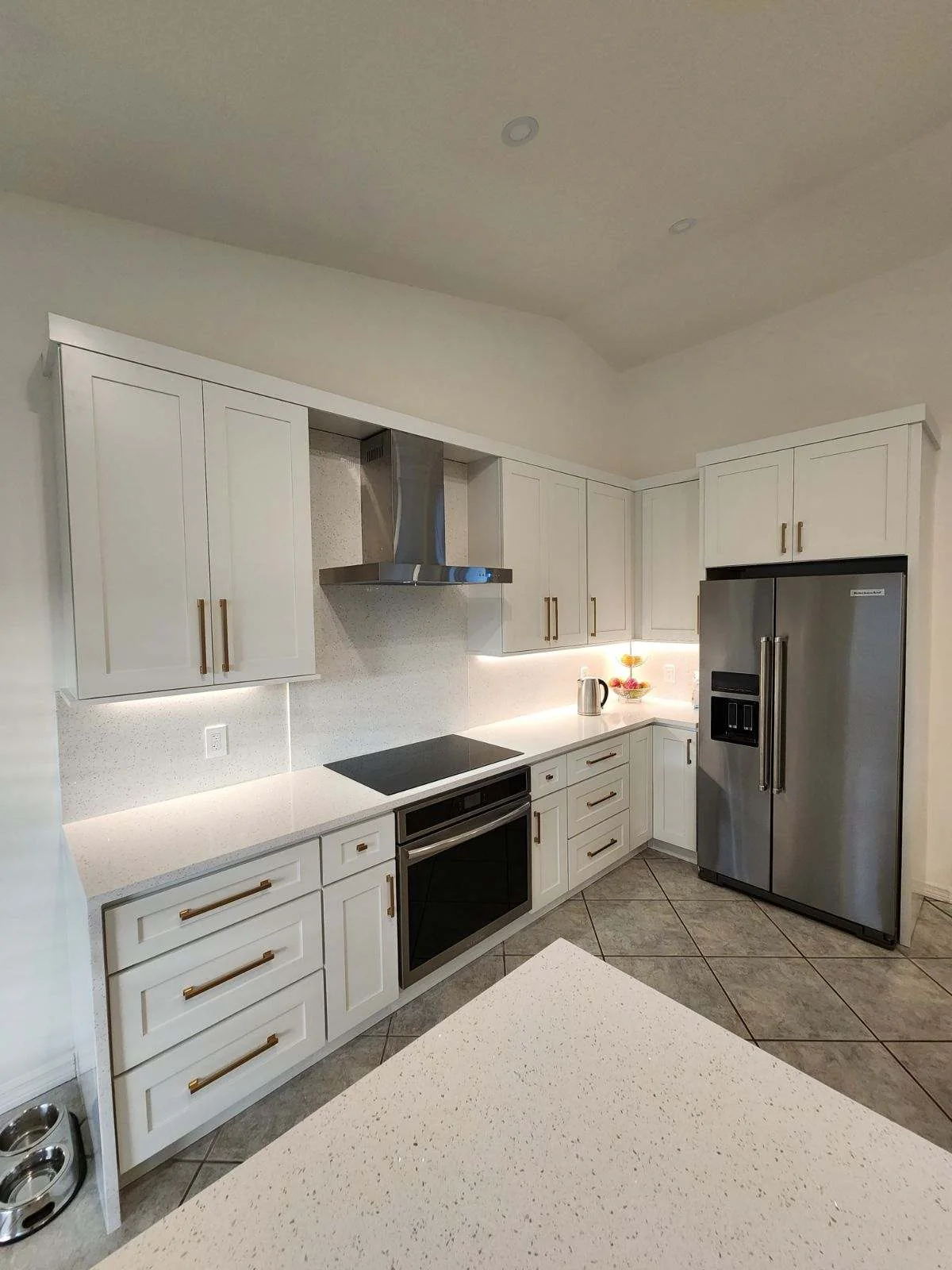 Finished Royal Renovations kitchen cabinet painting project with white cabinets