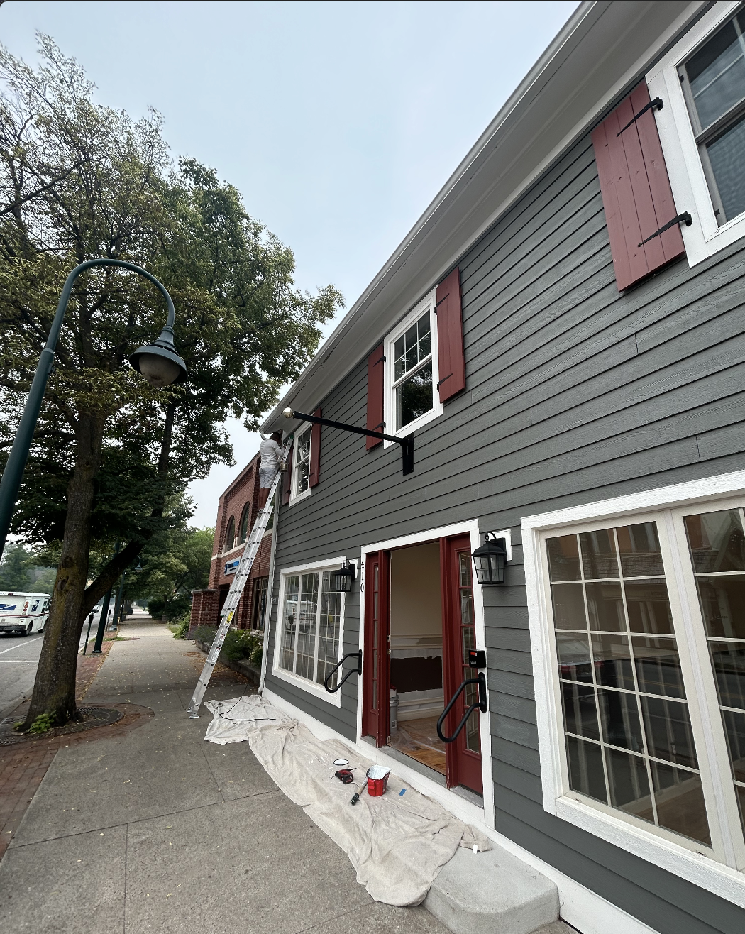 Commercial property maintenance painting on a storefront