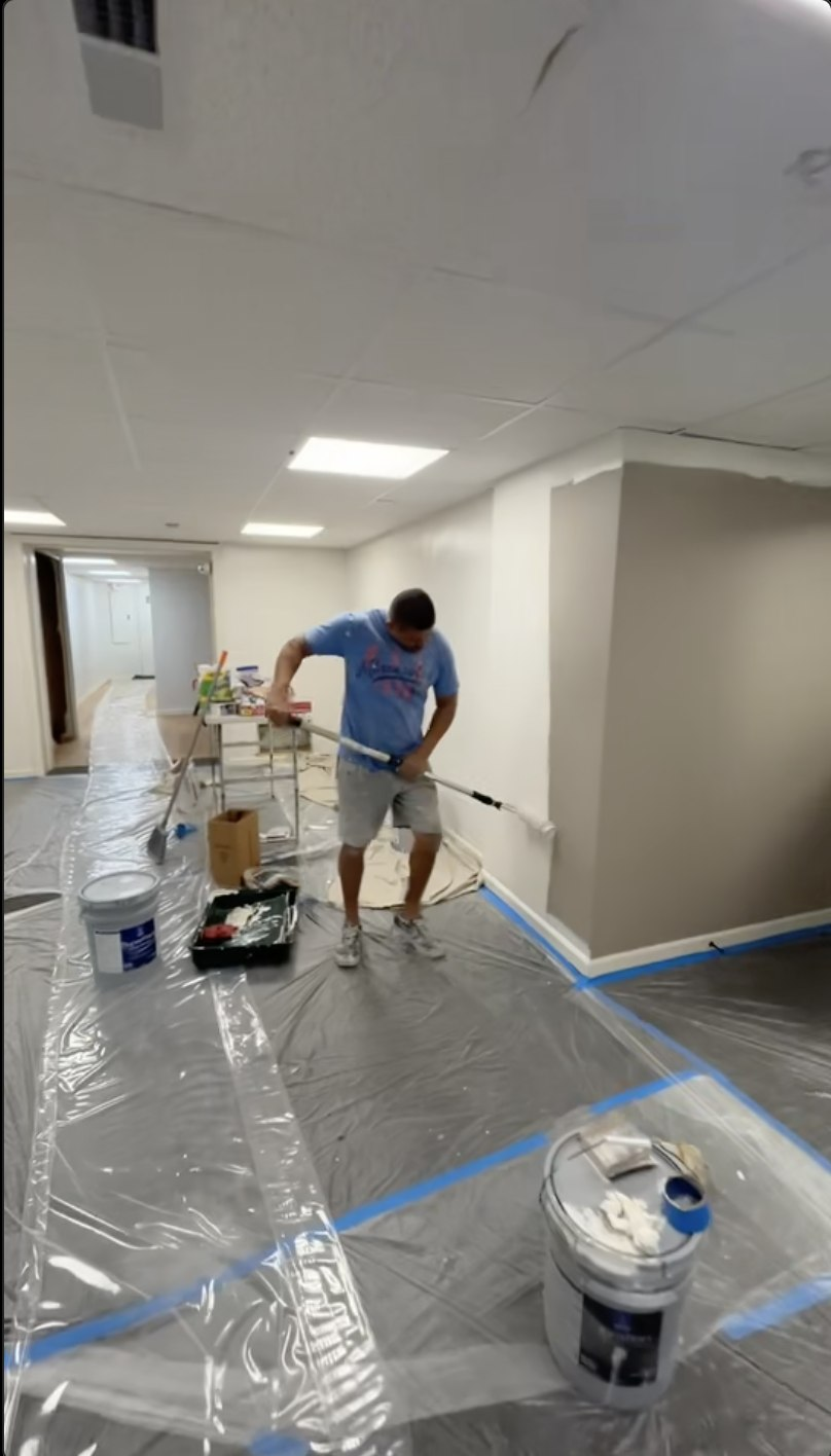 Drywall repair and painting process with protected floors
