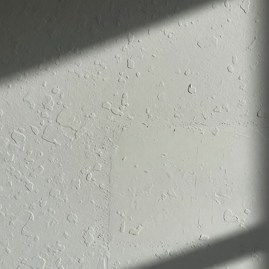 Residential drywall texture blend close-up after repair