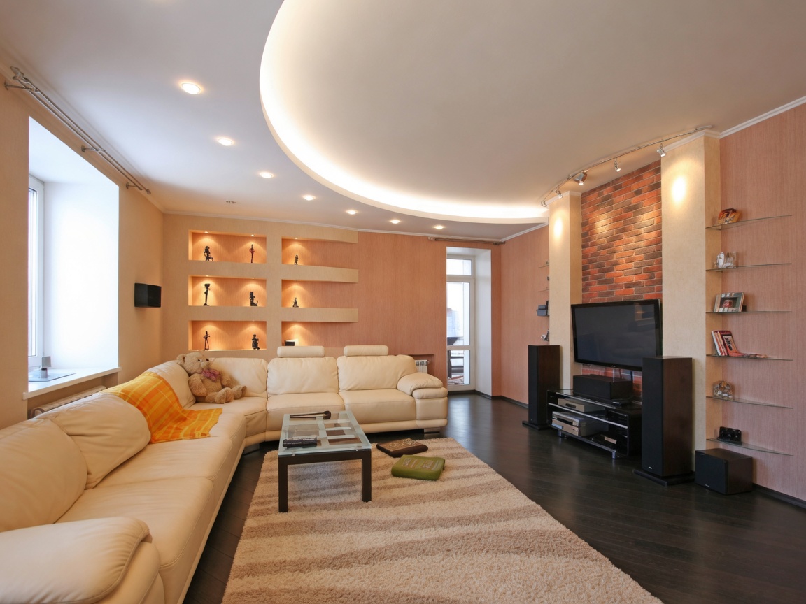 Residential room with curved tray ceiling and wall niches