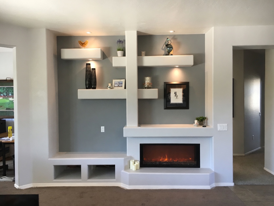 Residential media and fireplace drywall feature wall