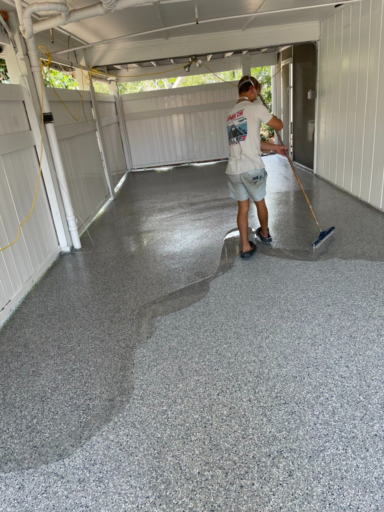 Applying finish coat over a gray flake garage floor