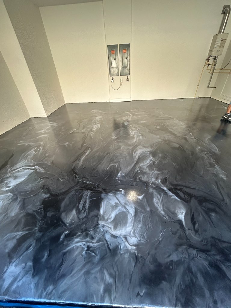 Finished gray metallic epoxy garage floor