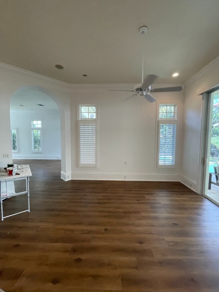 Finished interior room with warm white walls
