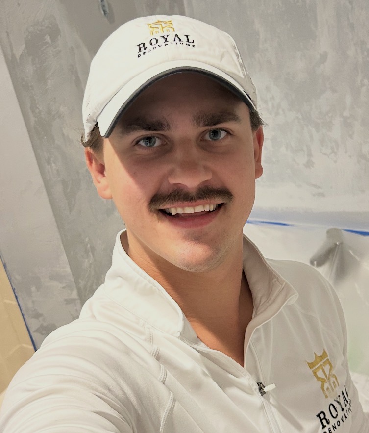 Jacob, owner of Royal Renovations, in branded cap and shirt