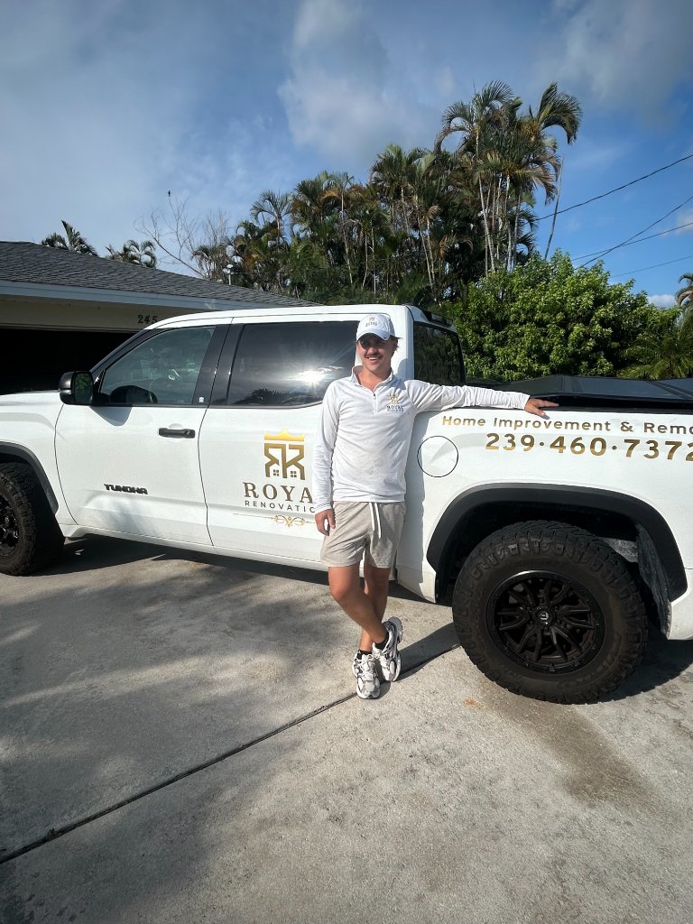 Jacob standing beside the Royal Renovations branded truck